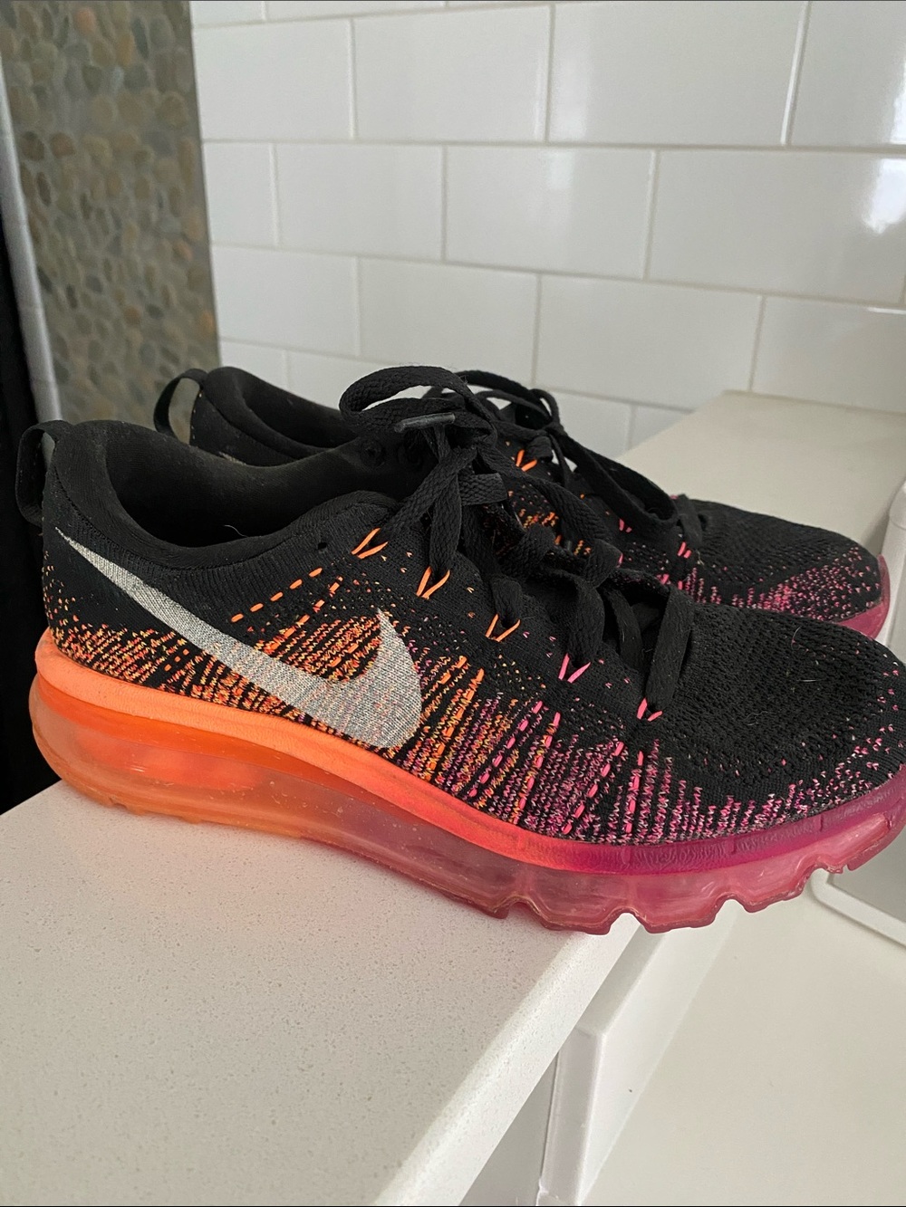 Nike Black Flyknit Running Shoes with Orange and Pink Gradient Sole